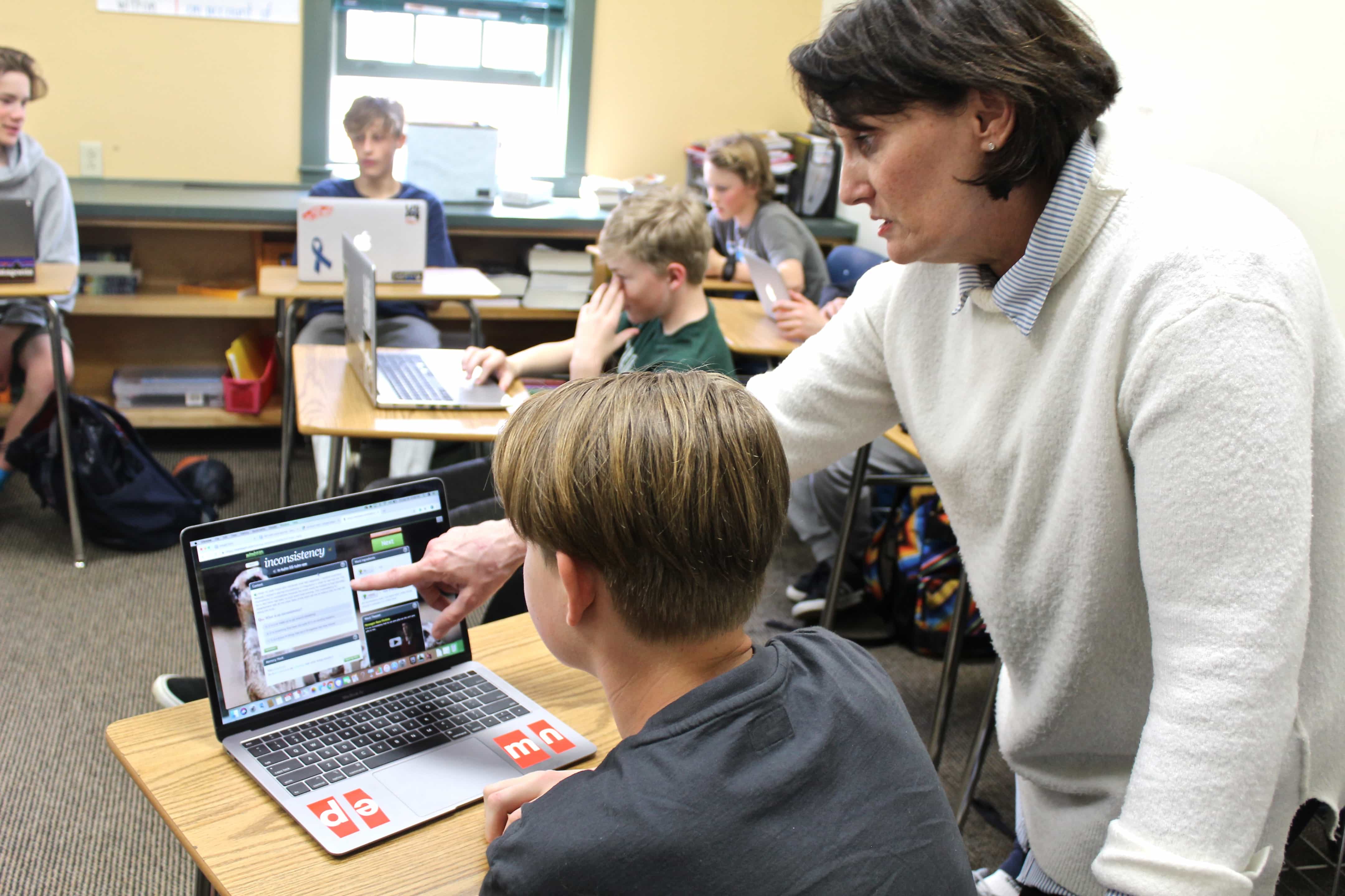 Mary Mangiacotti helping a student