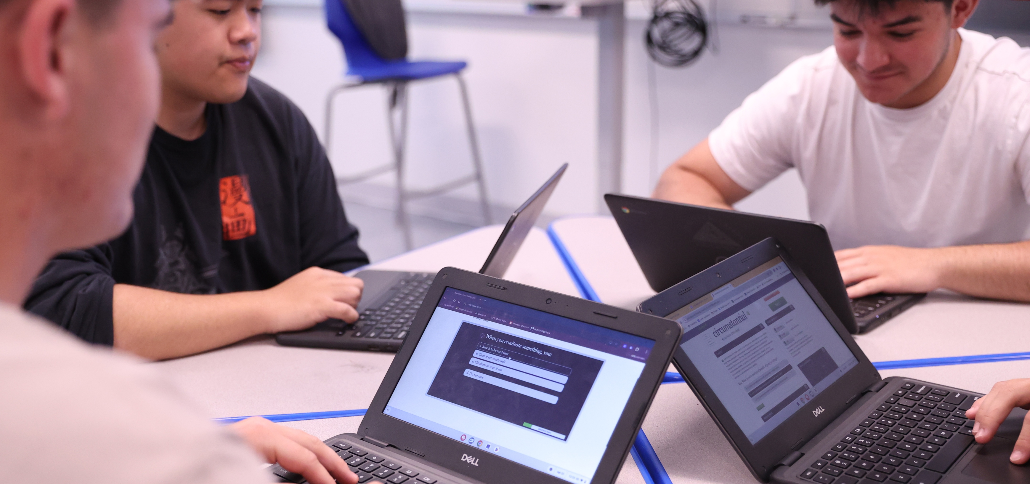 Students using Membean on their laptops