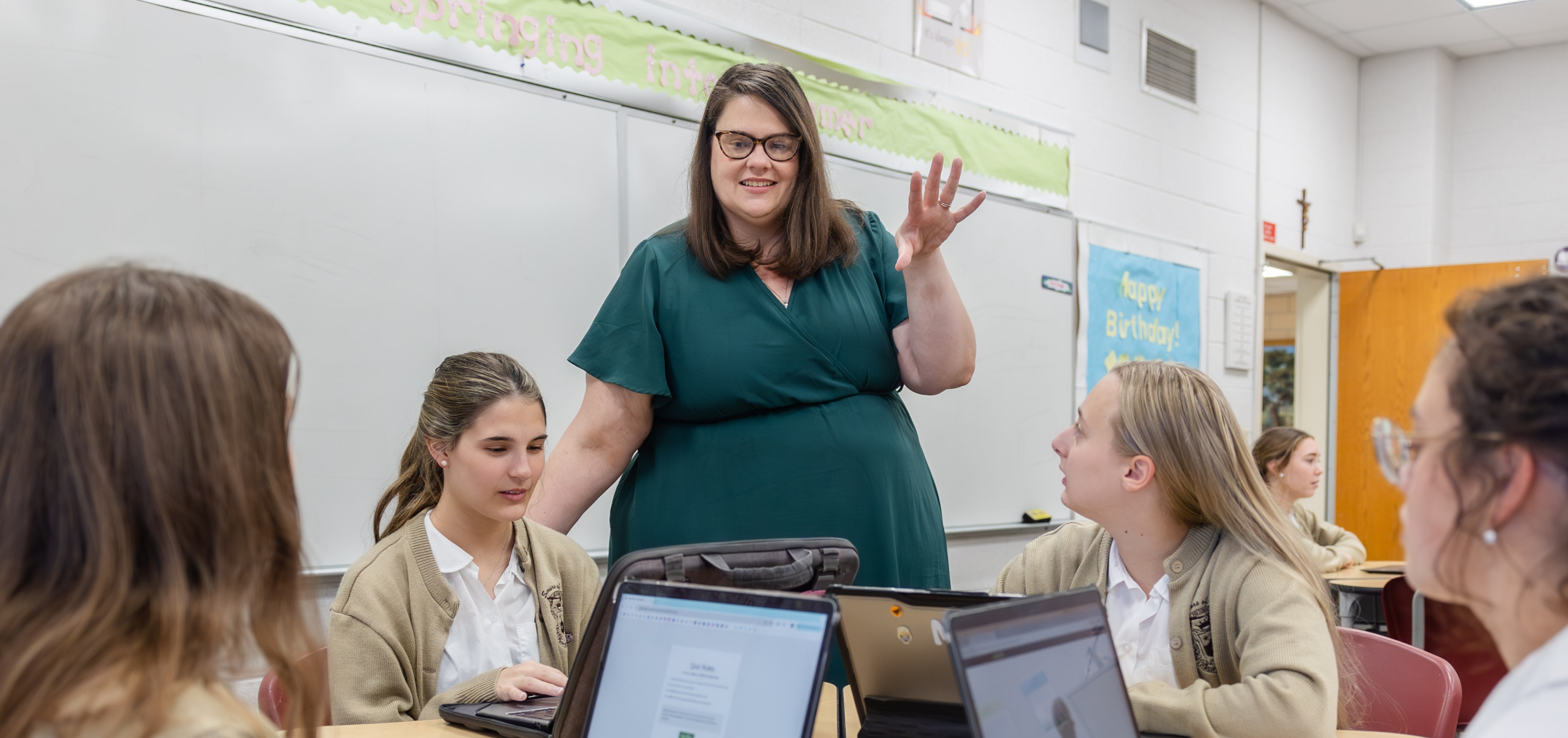 Teacher working with students